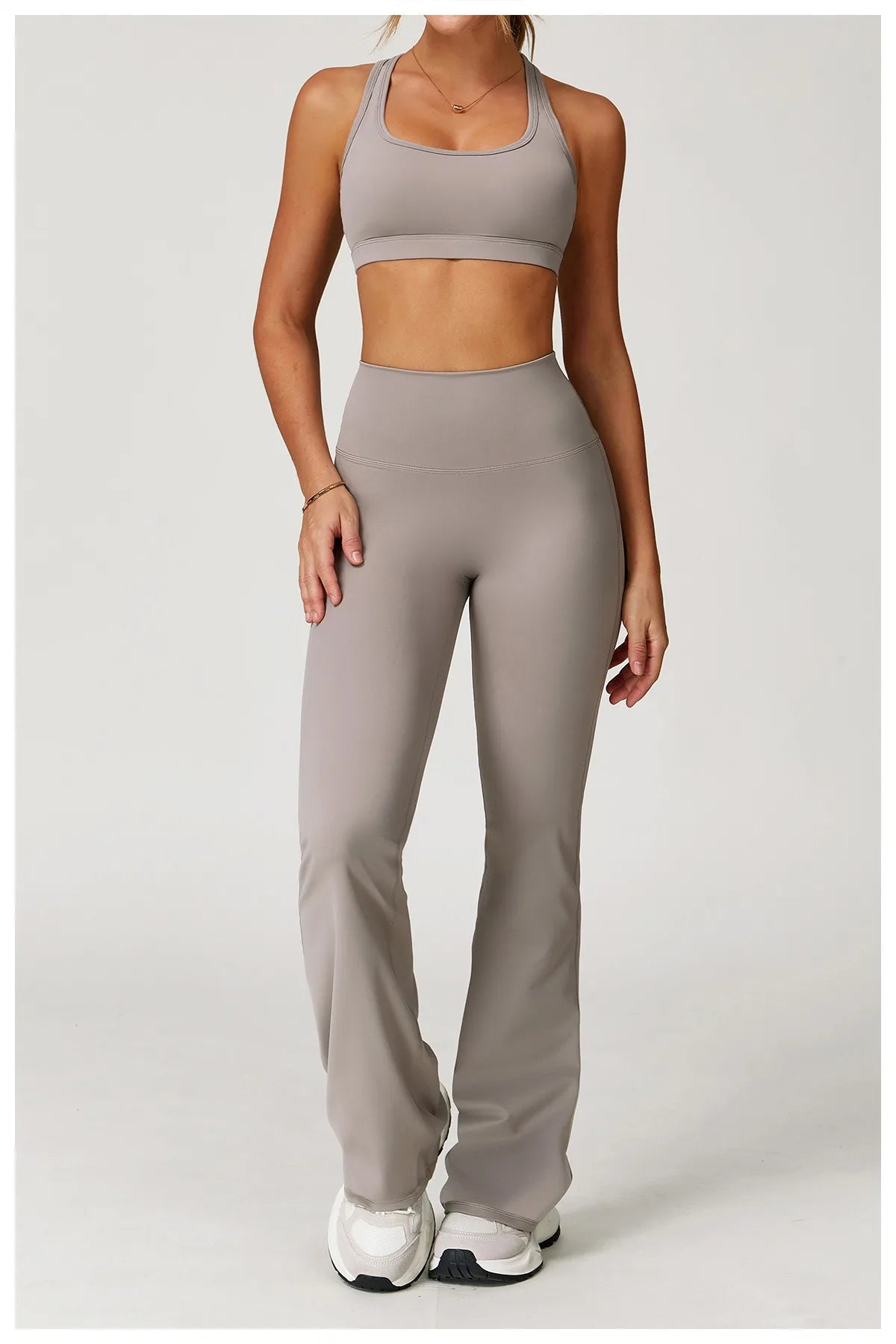 Xooie Fit women's workout set flared pants in taupe with matching sports bra and white sneakers