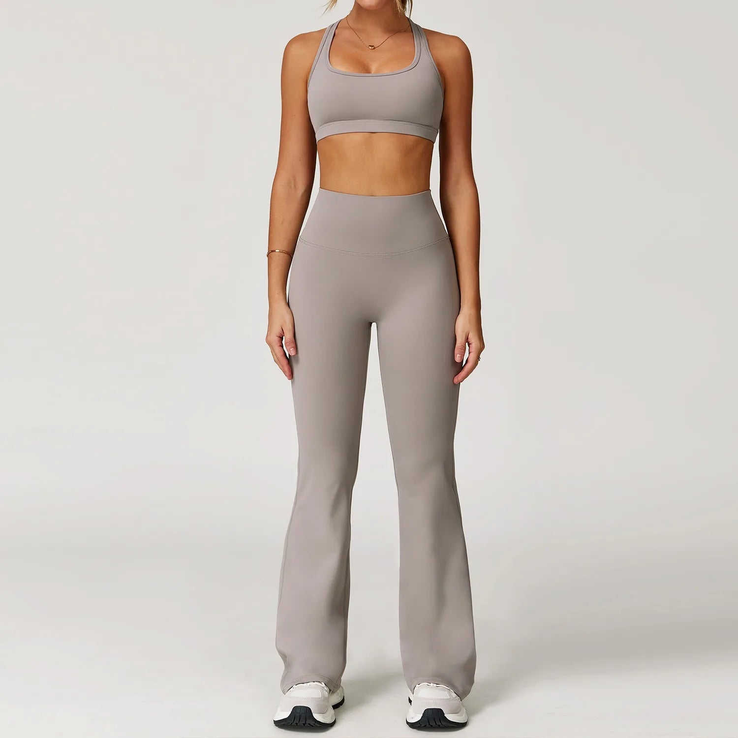 Xooie Fit two-piece women's workout set flared pants in beige with matching sports bra