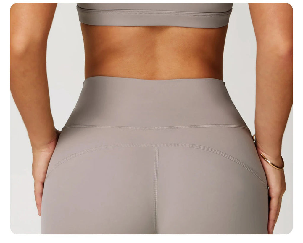 Xooie Fit women's workout set flared pants in taupe color showcasing high-waist fit and seamless design