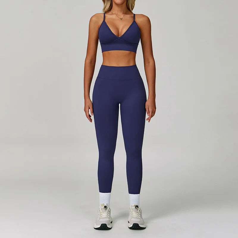 Xooie Fit women's workout set featuring a navy sports bra and matching leggings for active wear
