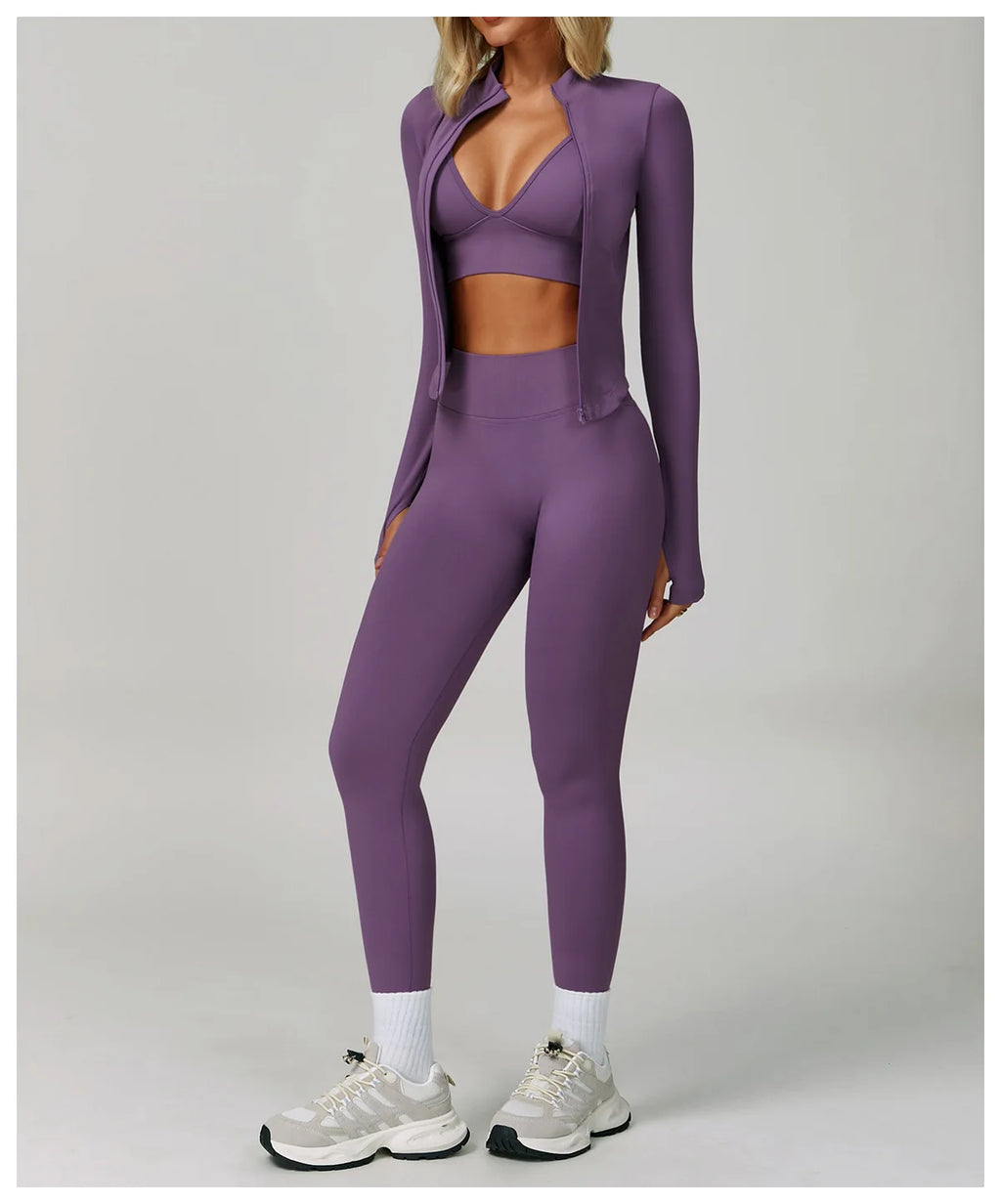 Xooie Fit women's workout set in purple featuring a fitted top and high-waisted leggings