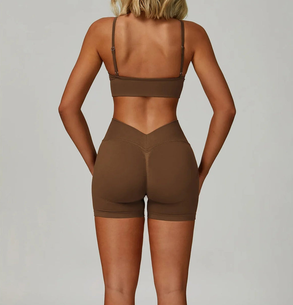 Xooie Fit women's workout set sports bra and shorts in brown with a stylish back design