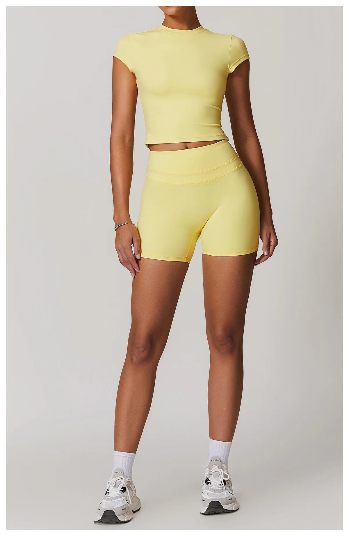 Xooie Fit yellow womens workout set with short sleeves and high-waisted shorts for active wear