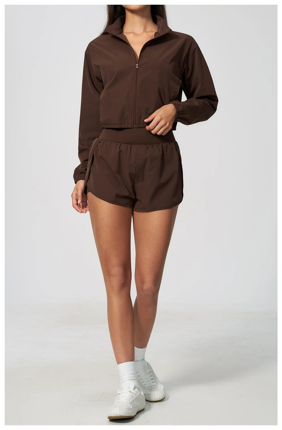 Brown zip-up long-sleeve sports jacket with matching shorts, front full-body
