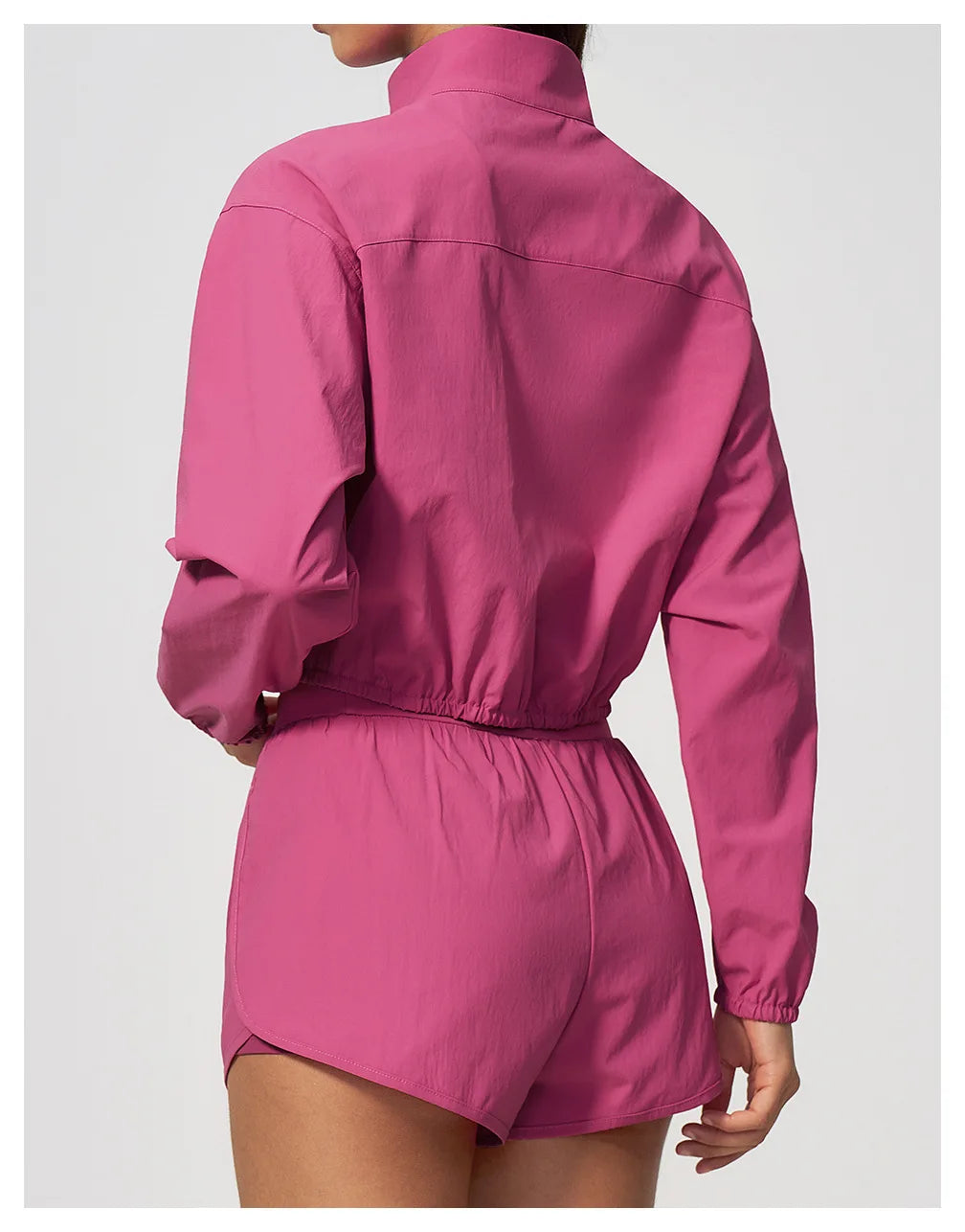 Pink back view zip-up athletic jacket with elastic waist and matching shorts