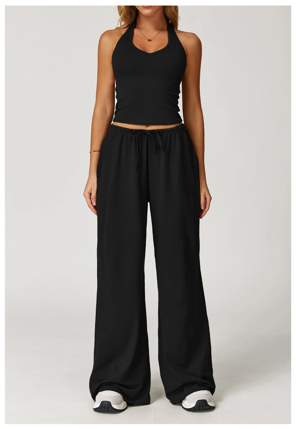 Stylish Xooie Fit tank top and baggy pants workout outfit in black for comfortable exercise