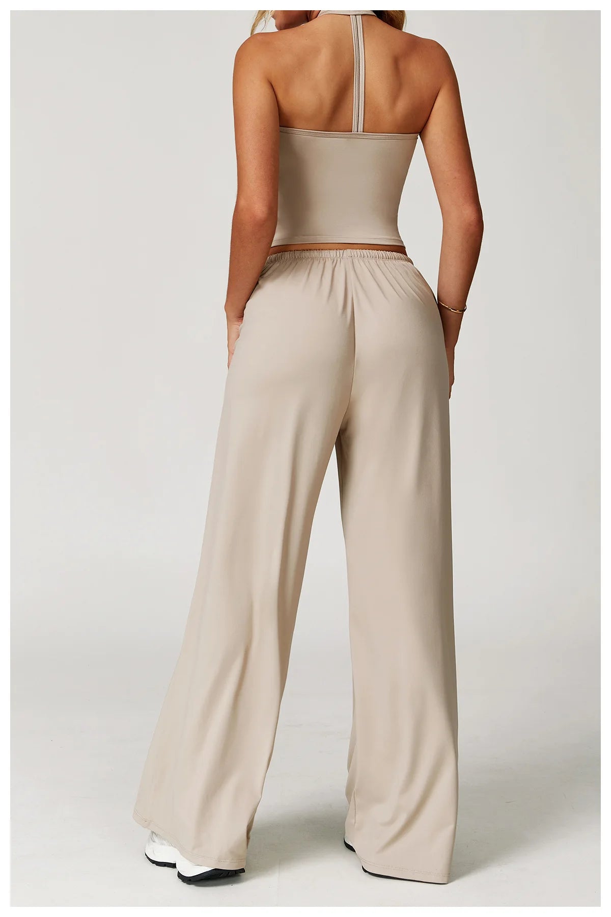 Xooie Fit two-piece set featuring a tank top and baggy pants workout outfit in beige color
