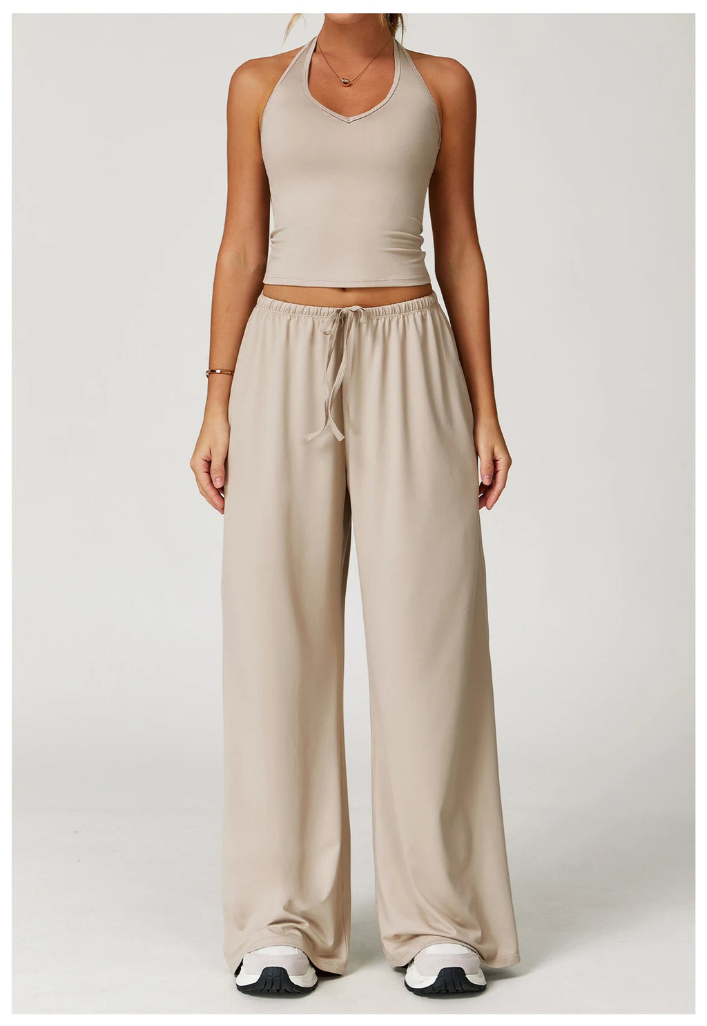 Xooie Fit Two-Piece Set featuring a tank top and baggy pants workout outfit in a neutral color