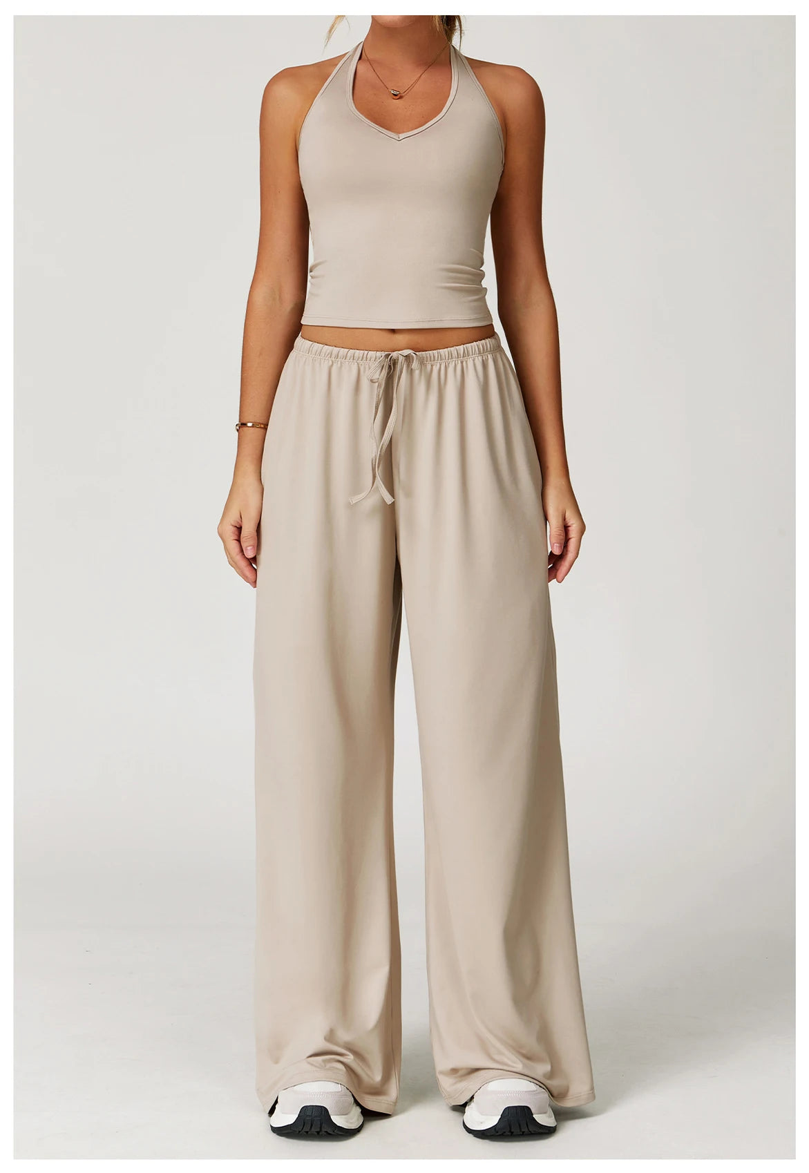 Xooie Fit Two-Piece Set featuring a tank top and baggy pants workout outfit in a neutral color