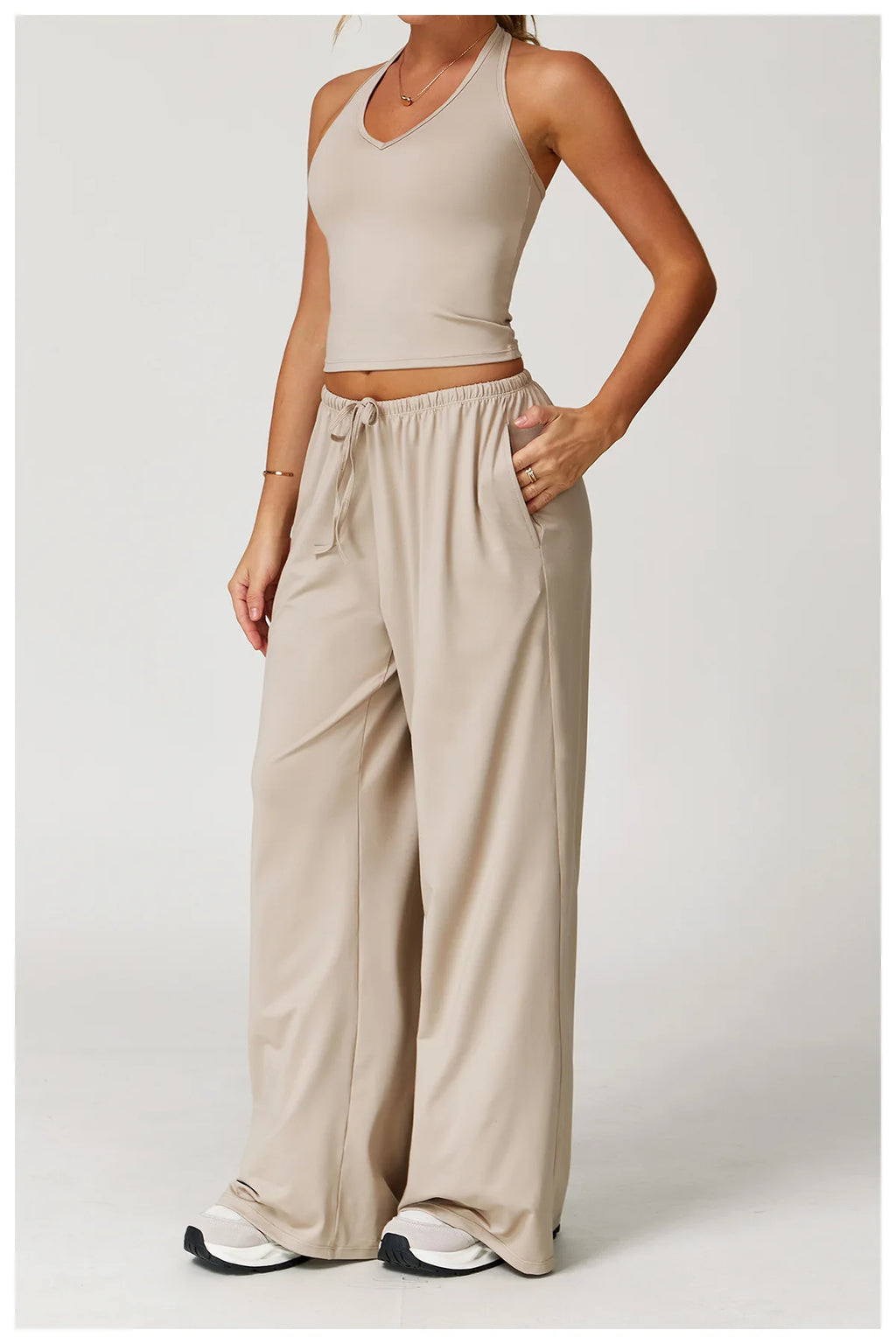 Xooie Fit tank top and baggy pants workout outfit in beige for comfortable exercise wear