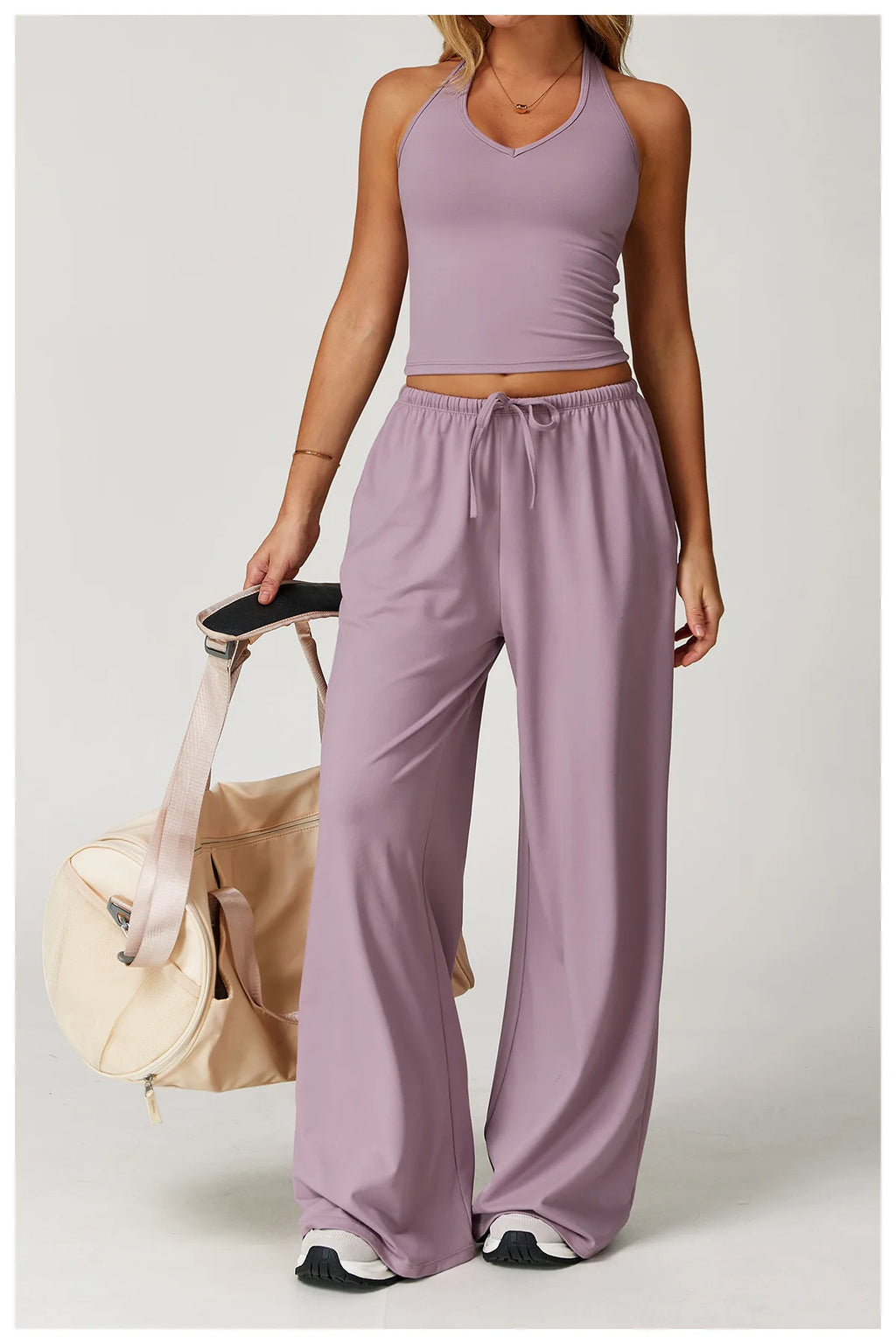 Xooie Fit two-piece set featuring a tank top and baggy pants workout outfit in soft lavender color