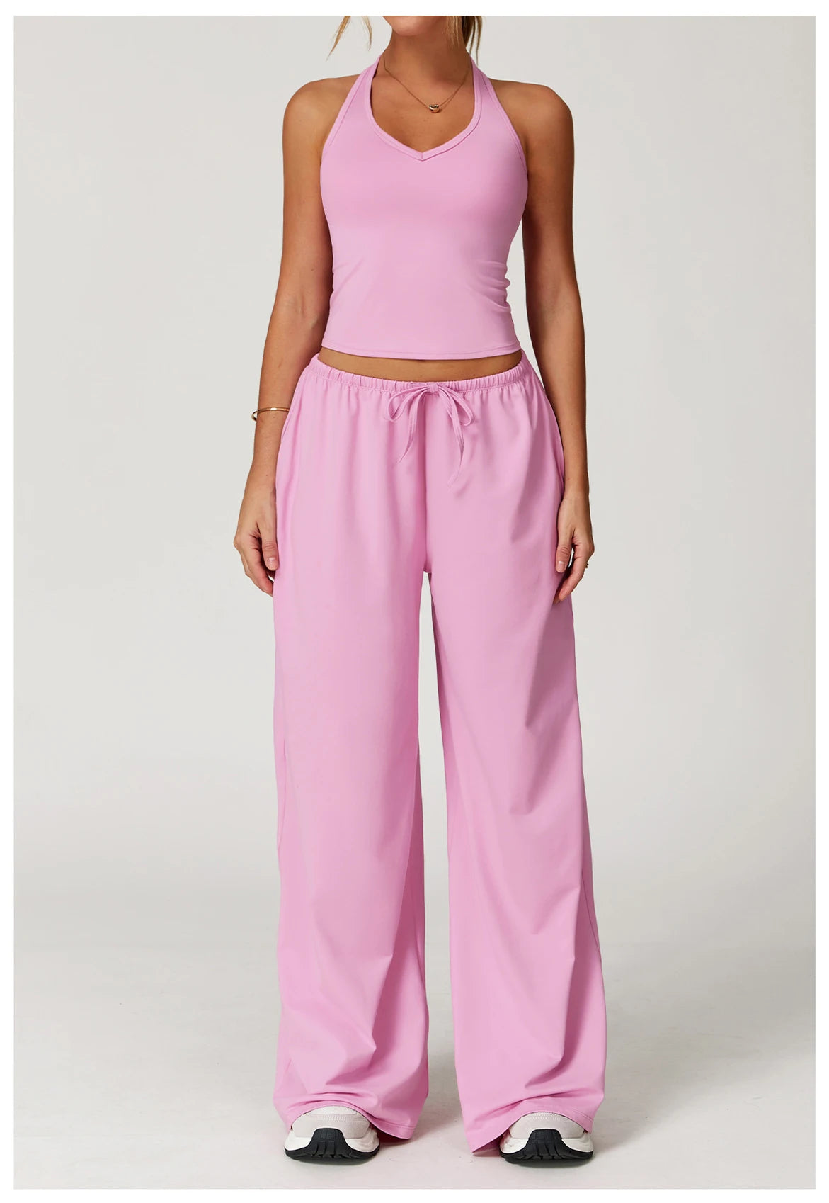 Xooie Fit pink tank top and baggy pants workout outfit for comfortable exercise sessions