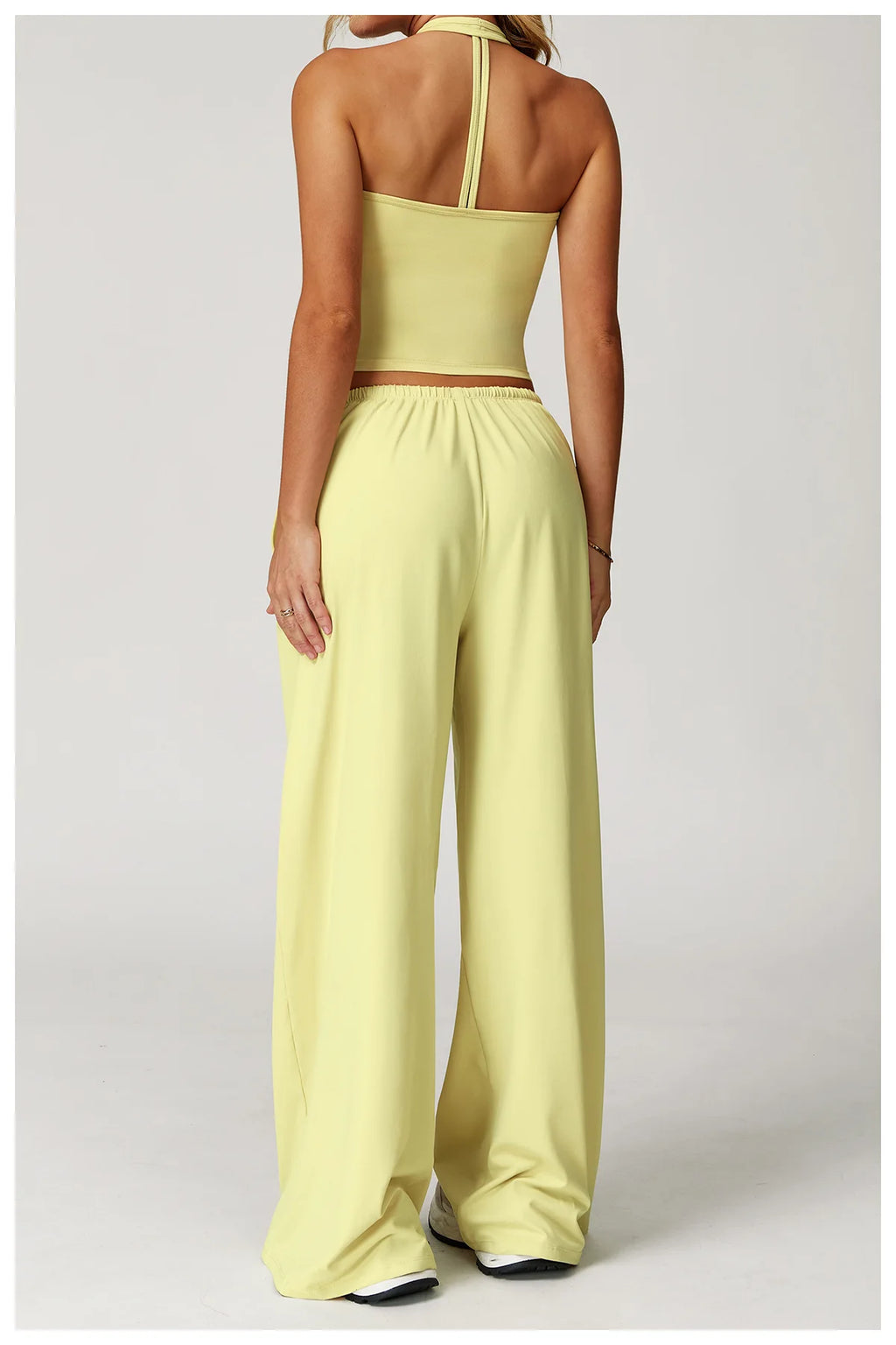 Xooie Fit Two-Piece Set featuring a tank top and baggy pants workout outfit in soft yellow color