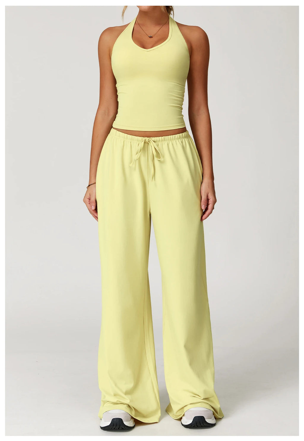 Xooie Fit tank top and baggy pants workout outfit in soft yellow for comfortable fitness activities