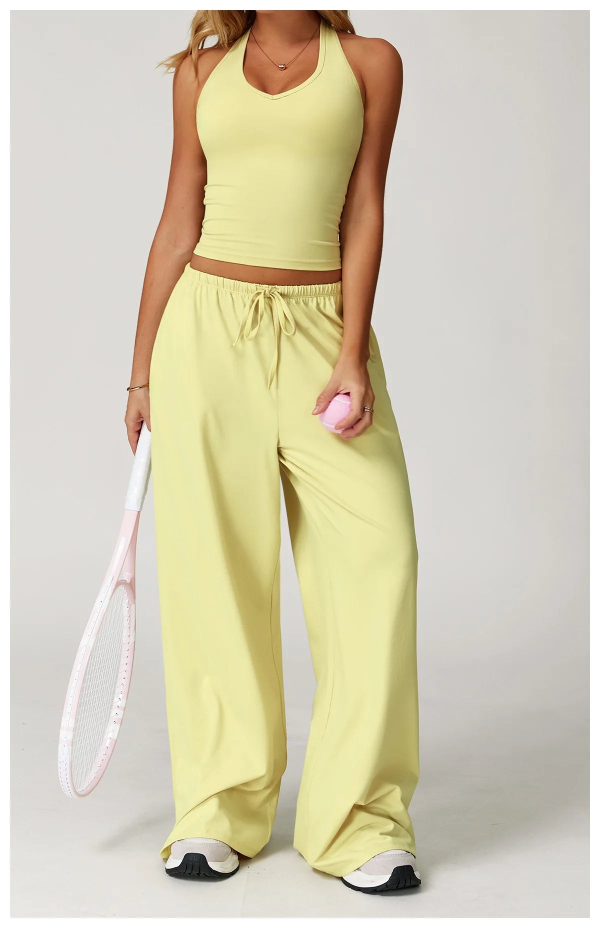 Xooie Fit tank top and baggy pants workout outfit in yellow, perfect for active wear and gym sessions