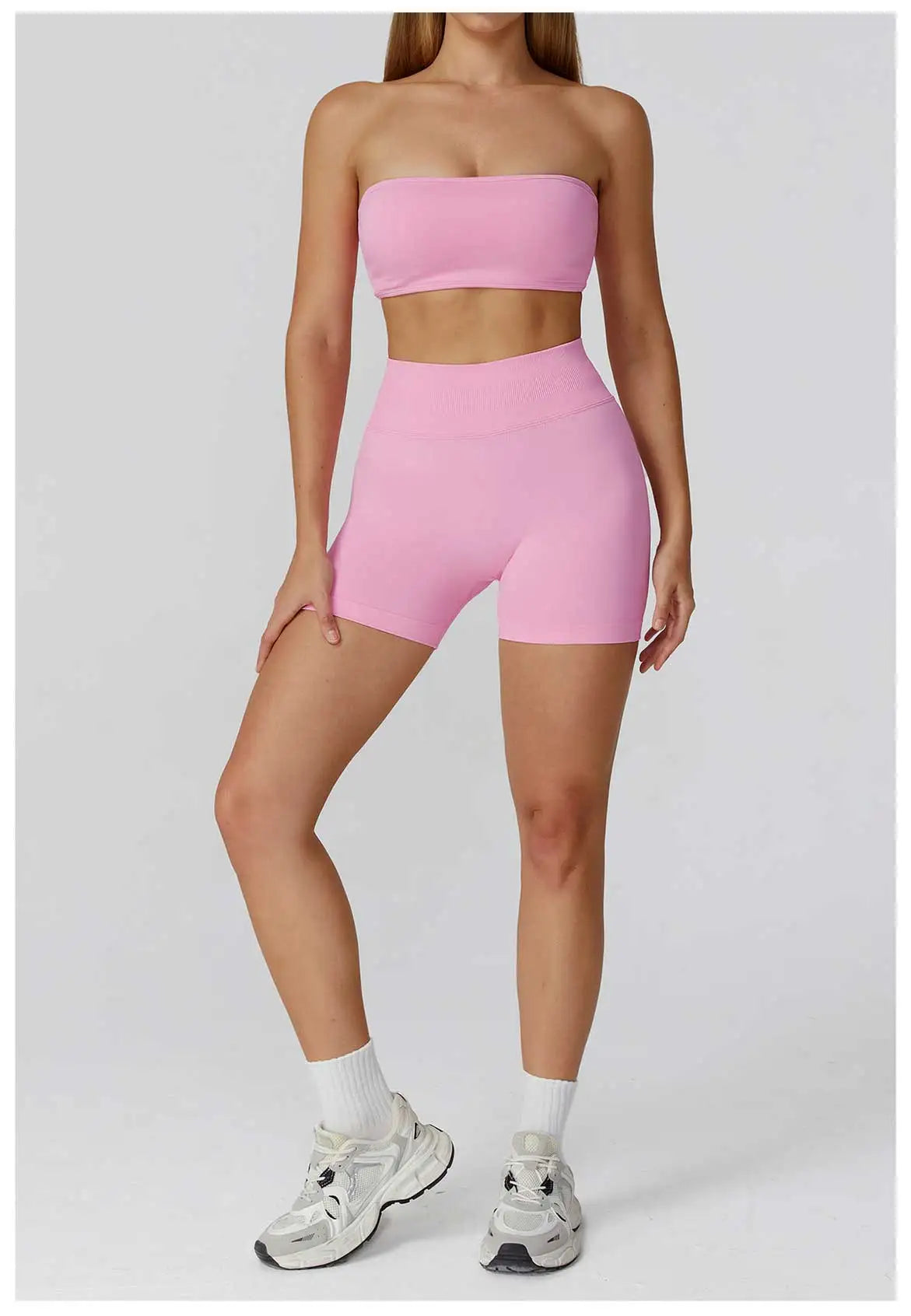 Xooie Fit Strapless workout set for women in pink with a crop top and fitted shorts