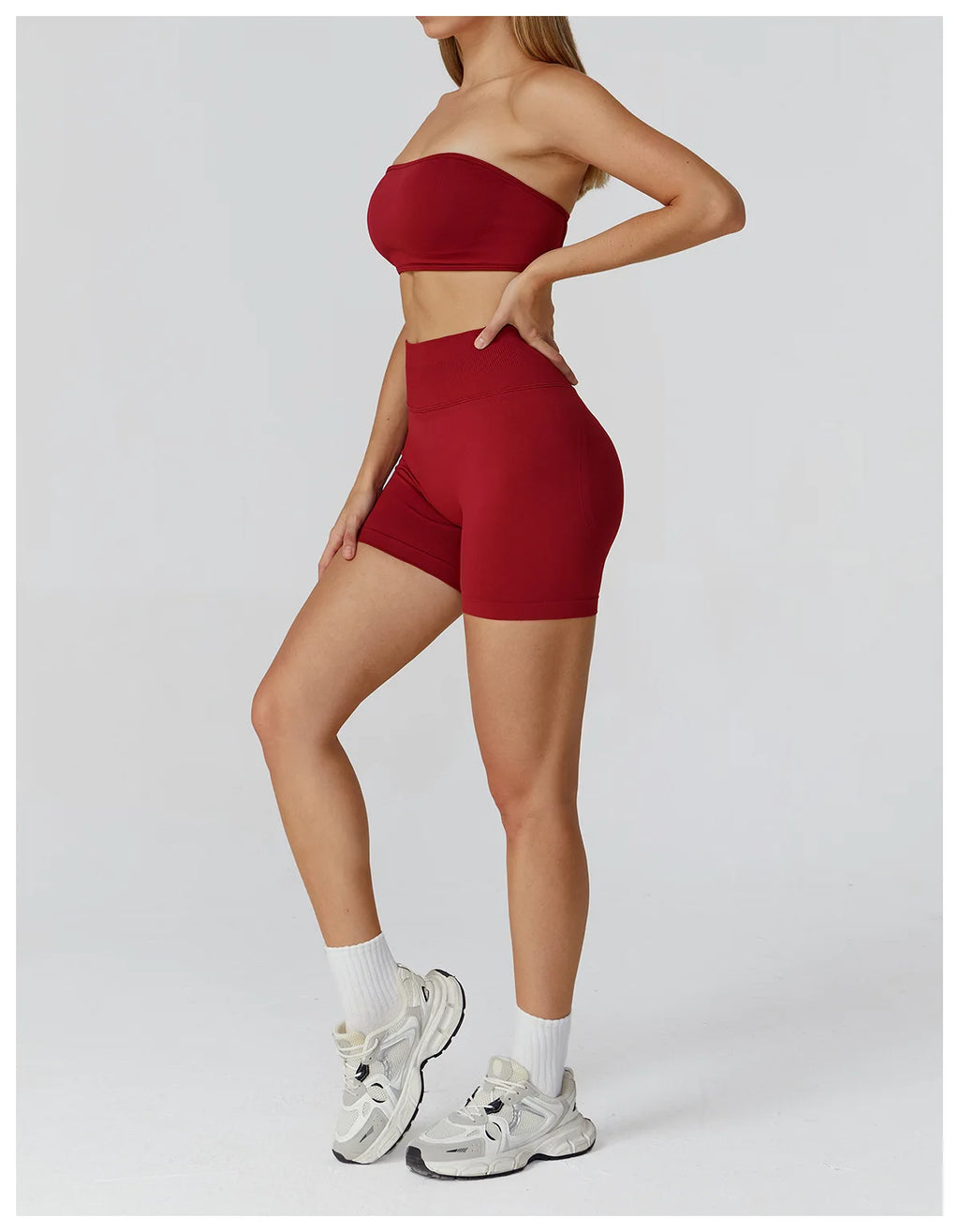 Xooie Fit strapless workout set for women in red featuring a bandeau top and high-waisted shorts