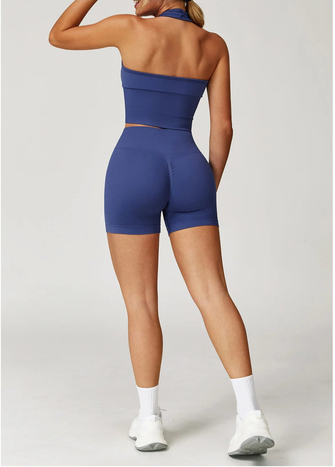 Xooie Fit halter tank top and shorts workout set in navy, featuring a stylish back design and comfortable fit