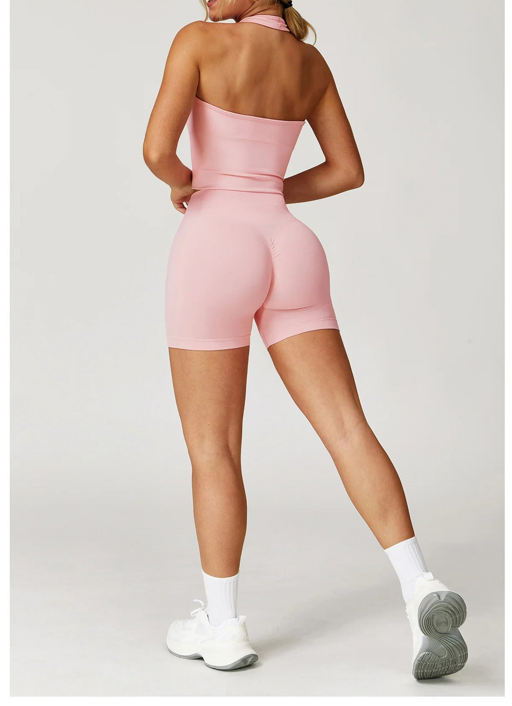 Pink halter tank top and matching shorts active set, back view
