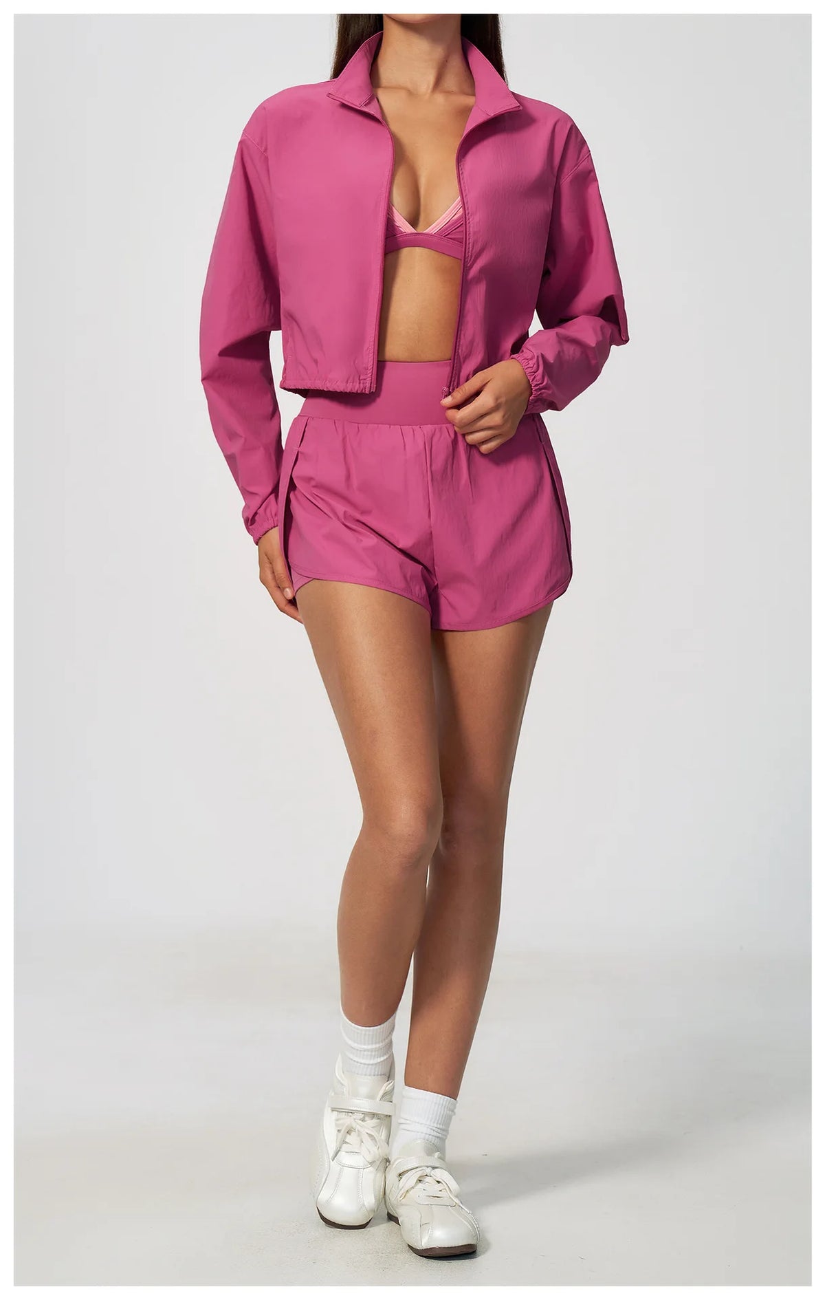 Pink athletic jacket and shorts set, zip front, collared neckline, long sleeves