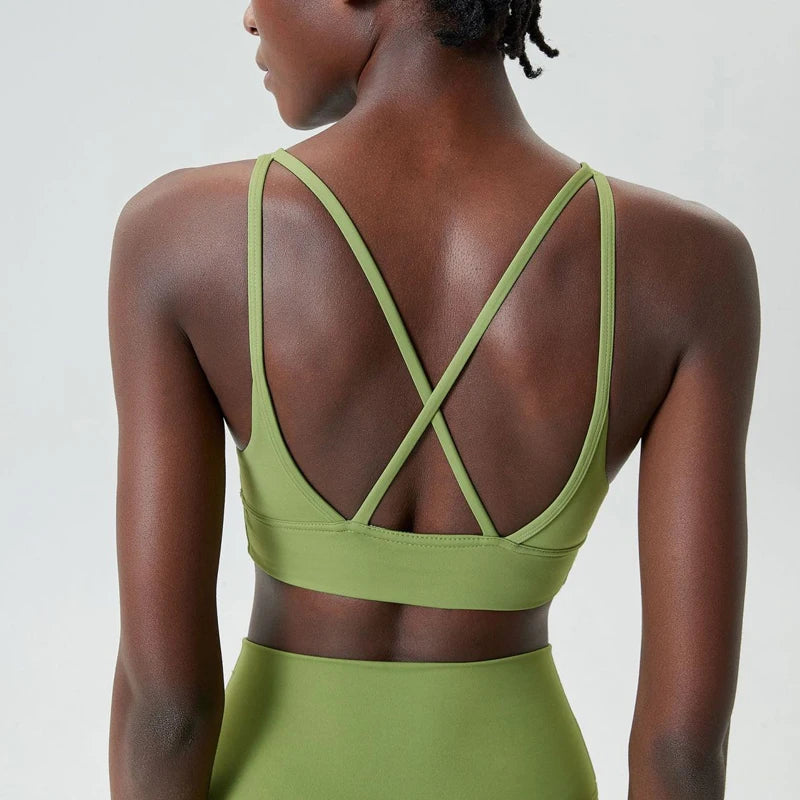 Xooie Fit X-Strap sports bra in green with stylish cross-back design for activewear comfort