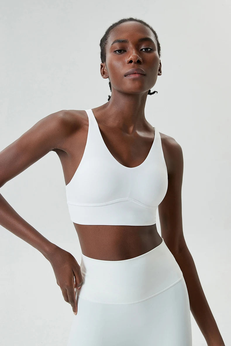 Xooie Fit x-strap sports bra in white, designed for comfort and support during workouts