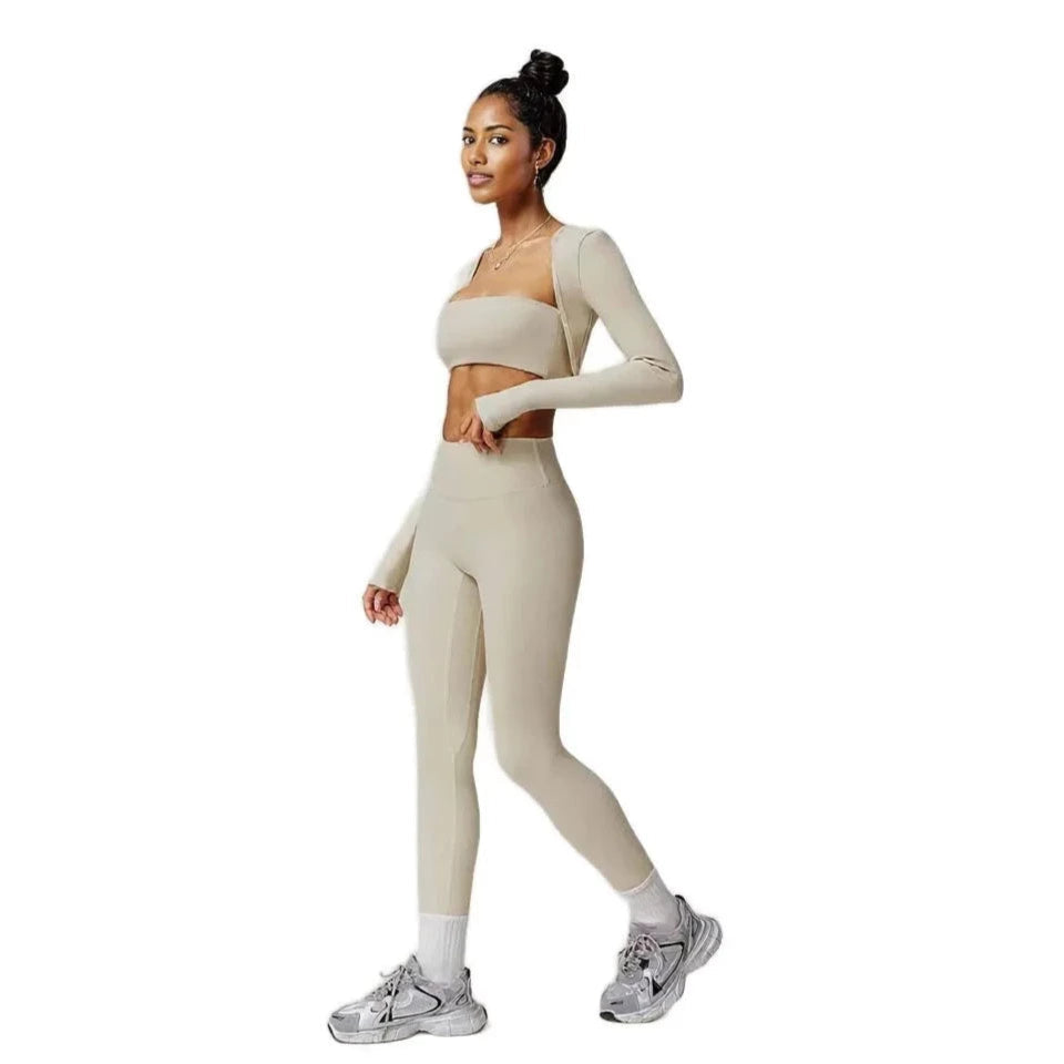 Xooie Fit 3-piece workout outfit in beige, featuring a crop top, long-sleeve shirt, and leggings