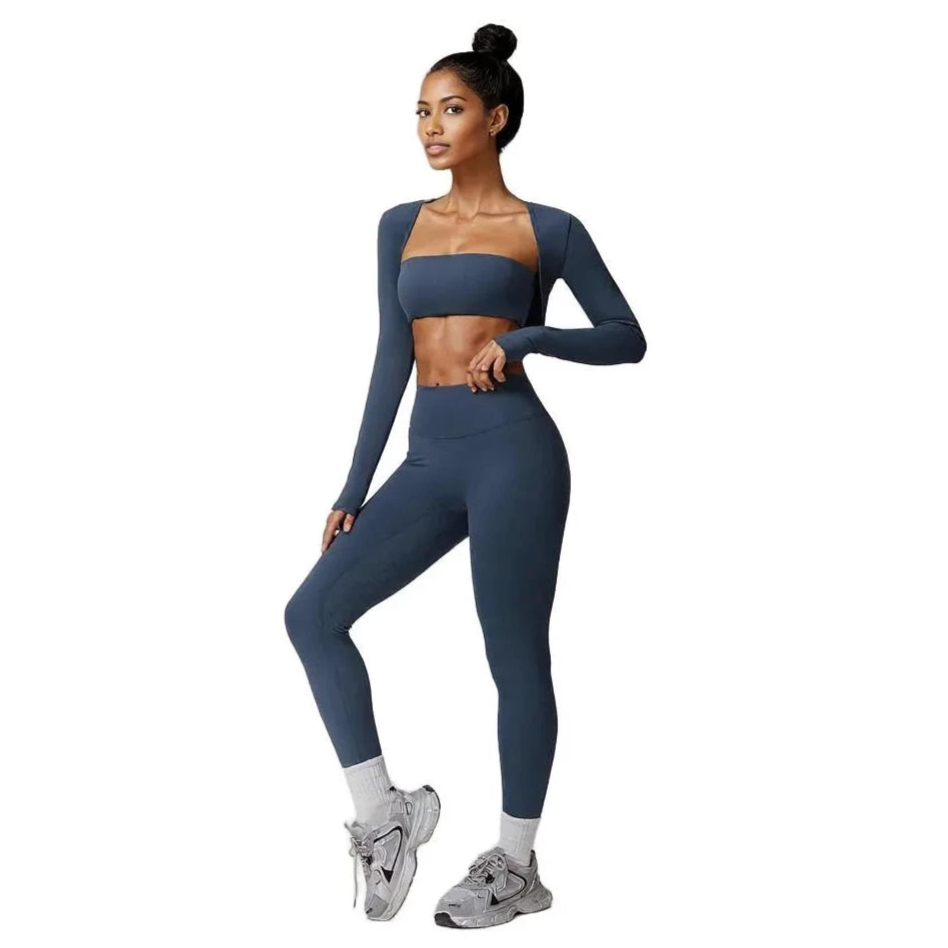 Xooie Fit 3-piece workout outfit in dark blue, featuring a crop top, long sleeves, and leggings for activewear.