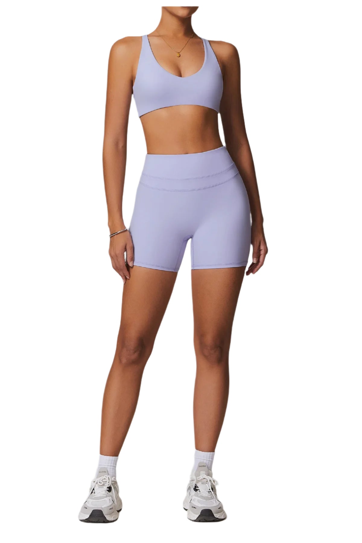 Xooie Fit women's fitness two-piece set in light purple, featuring a sporty bra and high-waisted shorts