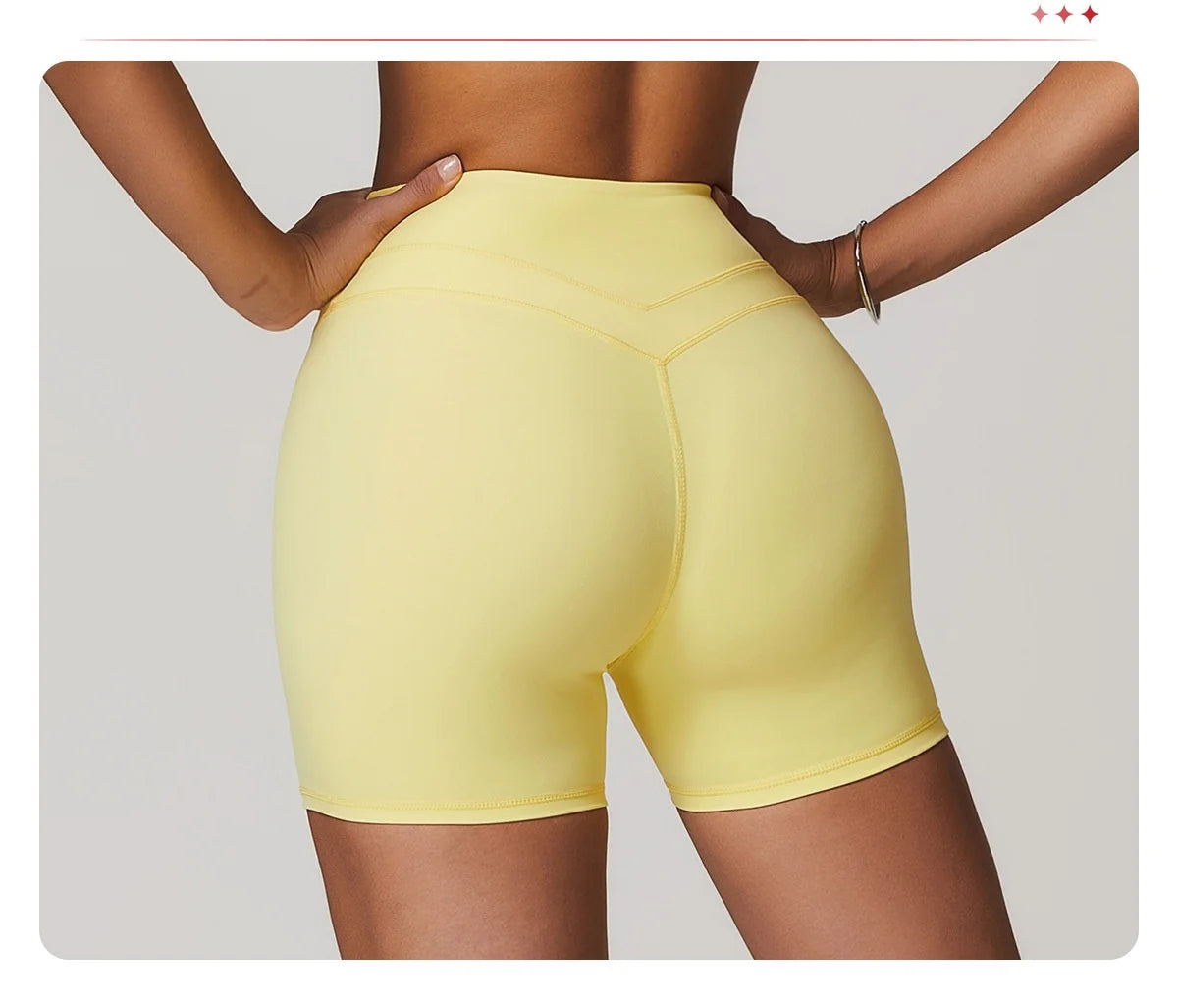 Xooie Fit women's fitness two-piece set featuring yellow high-waisted shorts for activewear