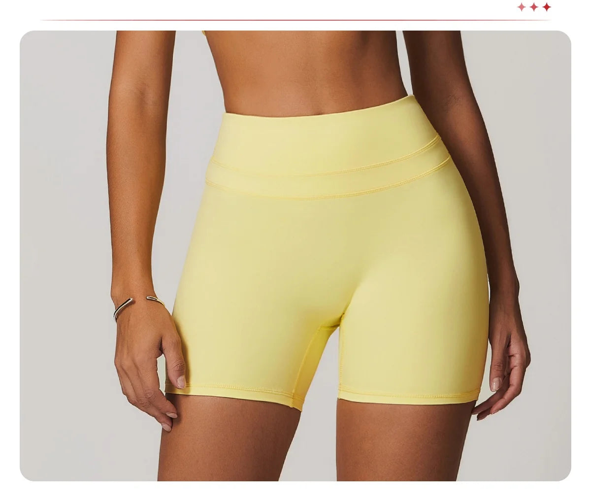 Xooie Fit women's fitness two-piece set featuring stylish yellow shorts for active workouts