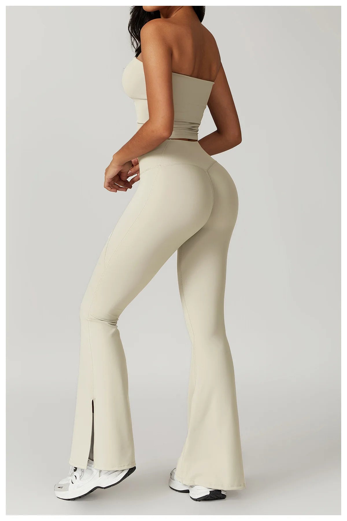 Xooie Fit women's flared fitness set in beige with a cropped top and flared pants for stylish workouts
