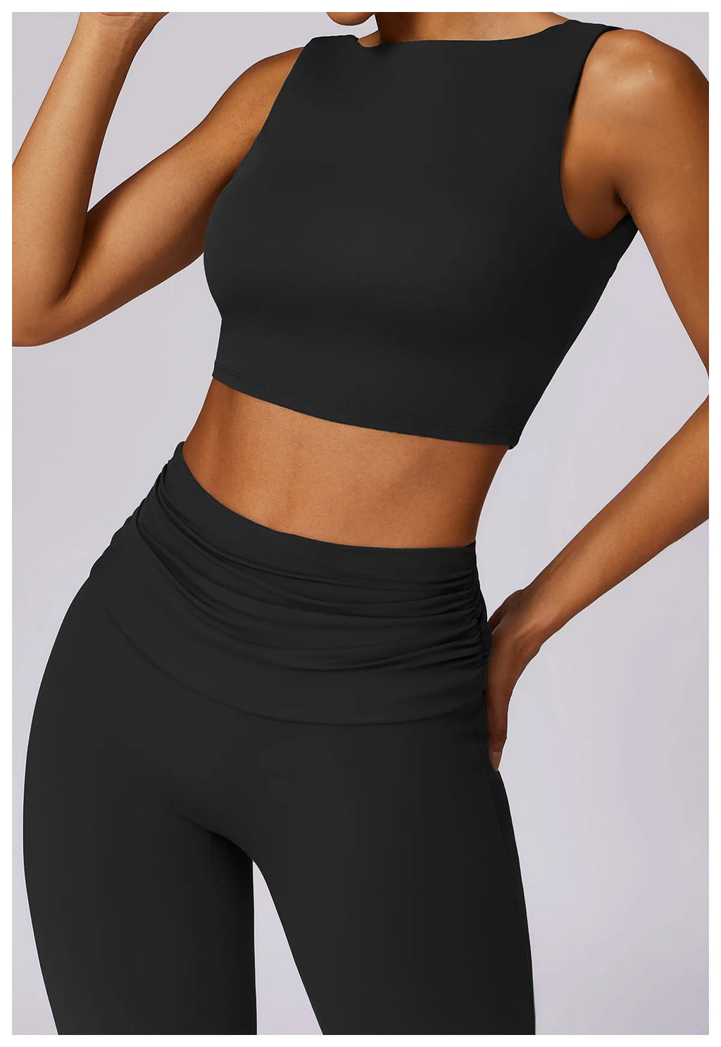 Black sleeveless sports bra crop top with smooth, stretch fabric