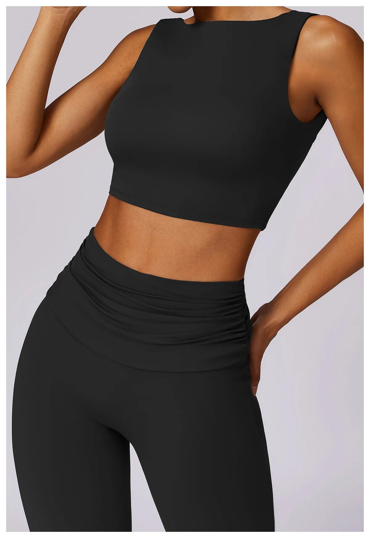 Black sleeveless sports bra crop top with smooth, stretch fabric