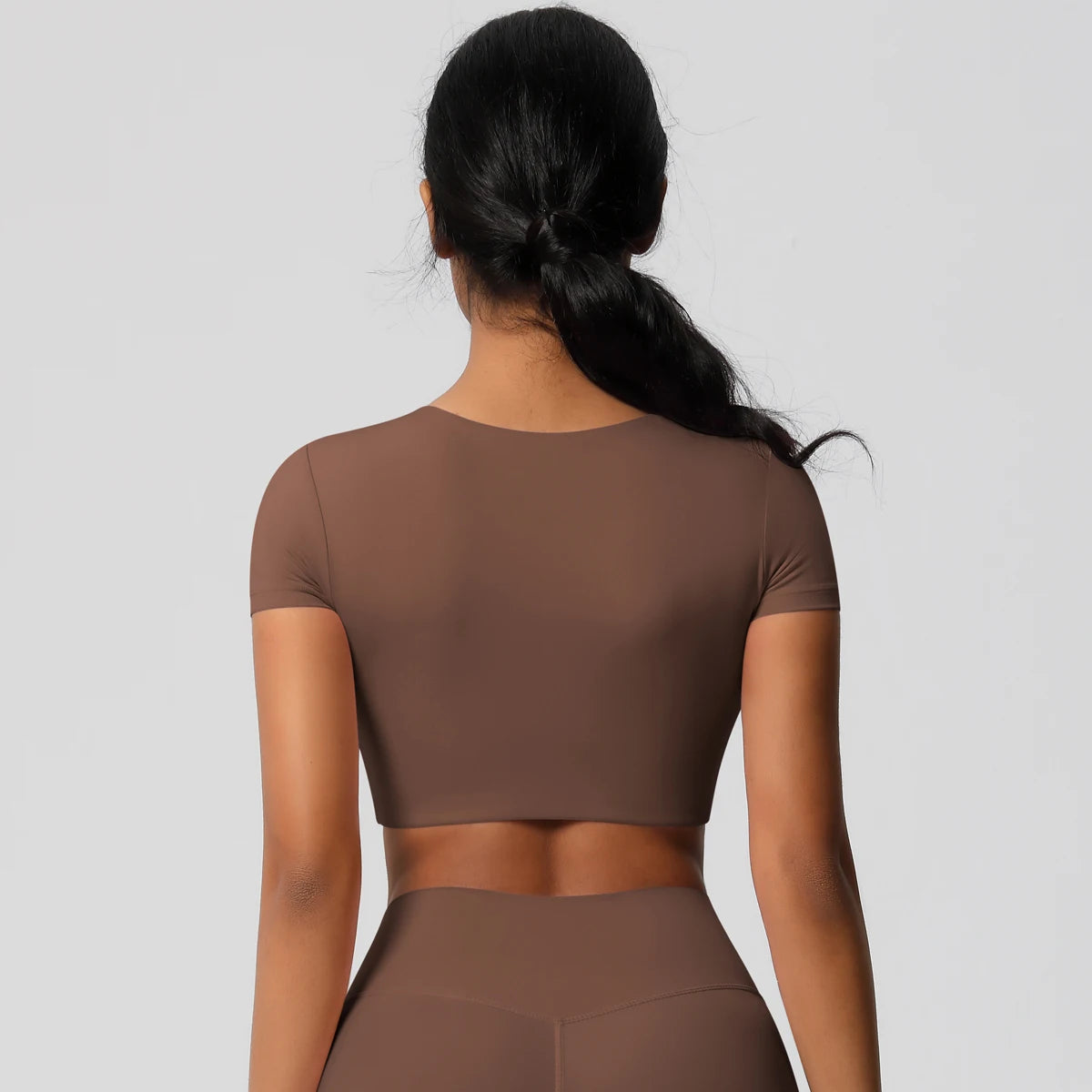 Brown Xooie Fit yoga crop top t-shirt designed for comfort and flexibility during workouts