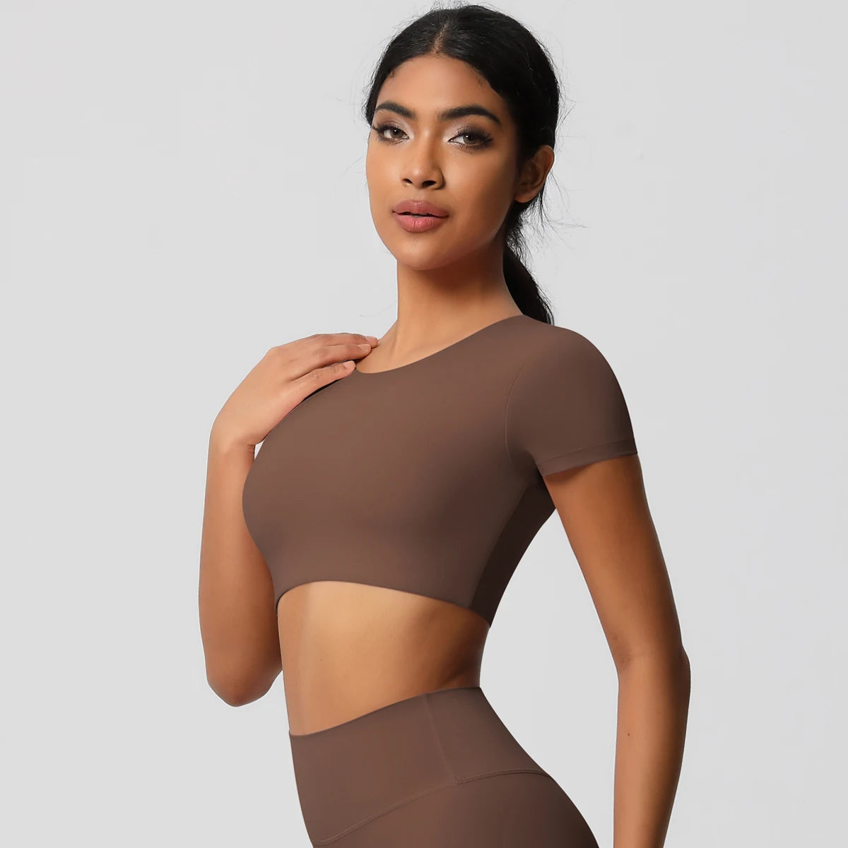 Xooie Fit yoga crop top t-shirt in brown, designed for comfort during workouts and yoga sessions