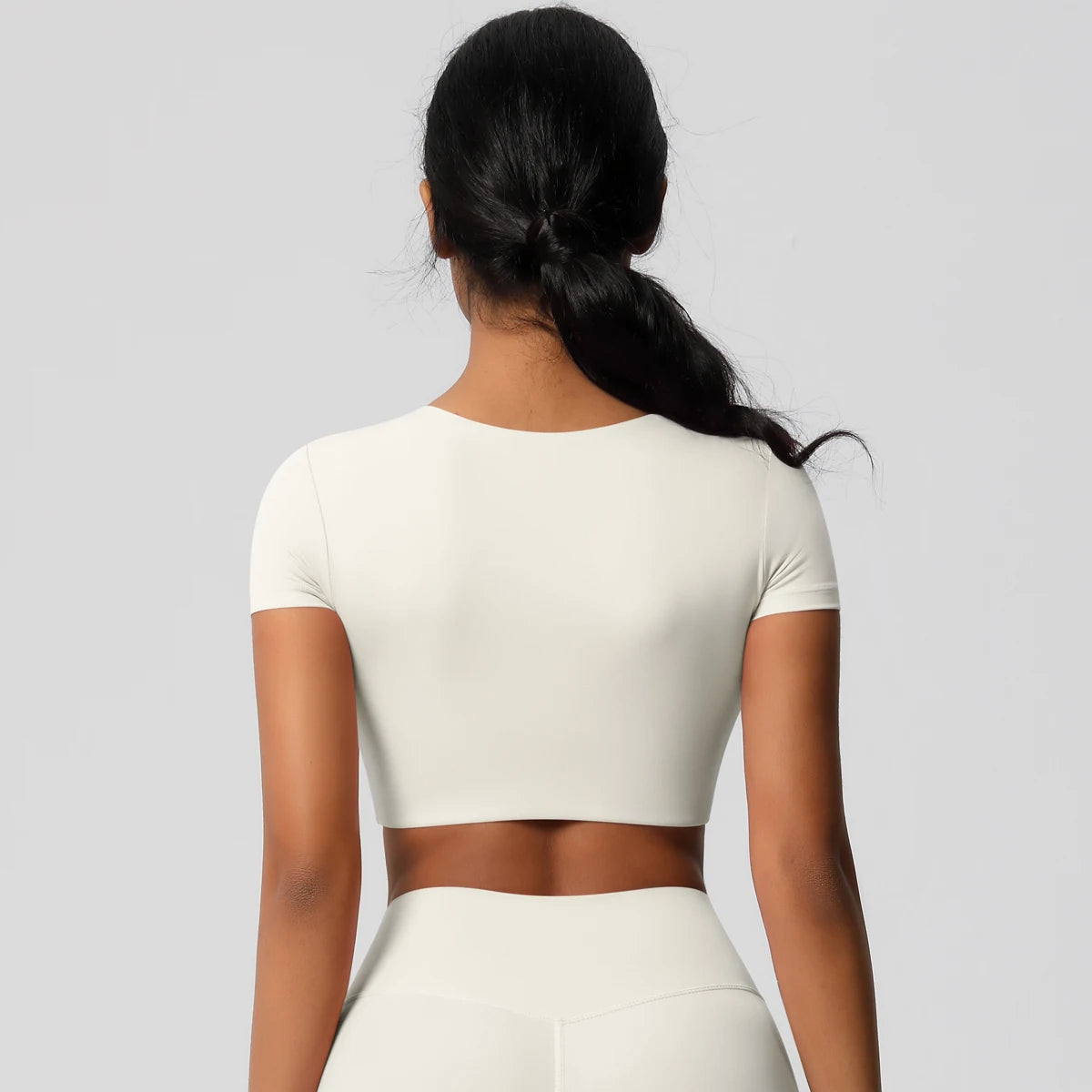 Xooie Fit Women's Yoga Crop Top T-Shirt in White, perfect for workout routines and yoga sessions