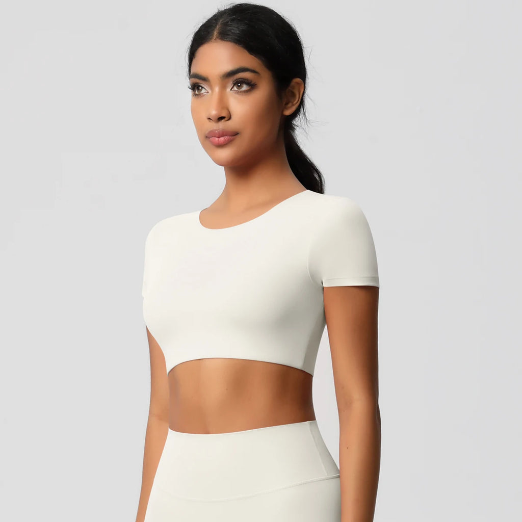 Xooie Fit yoga crop top t-shirt in white, featuring a short sleeve and fitted design for comfort during workouts