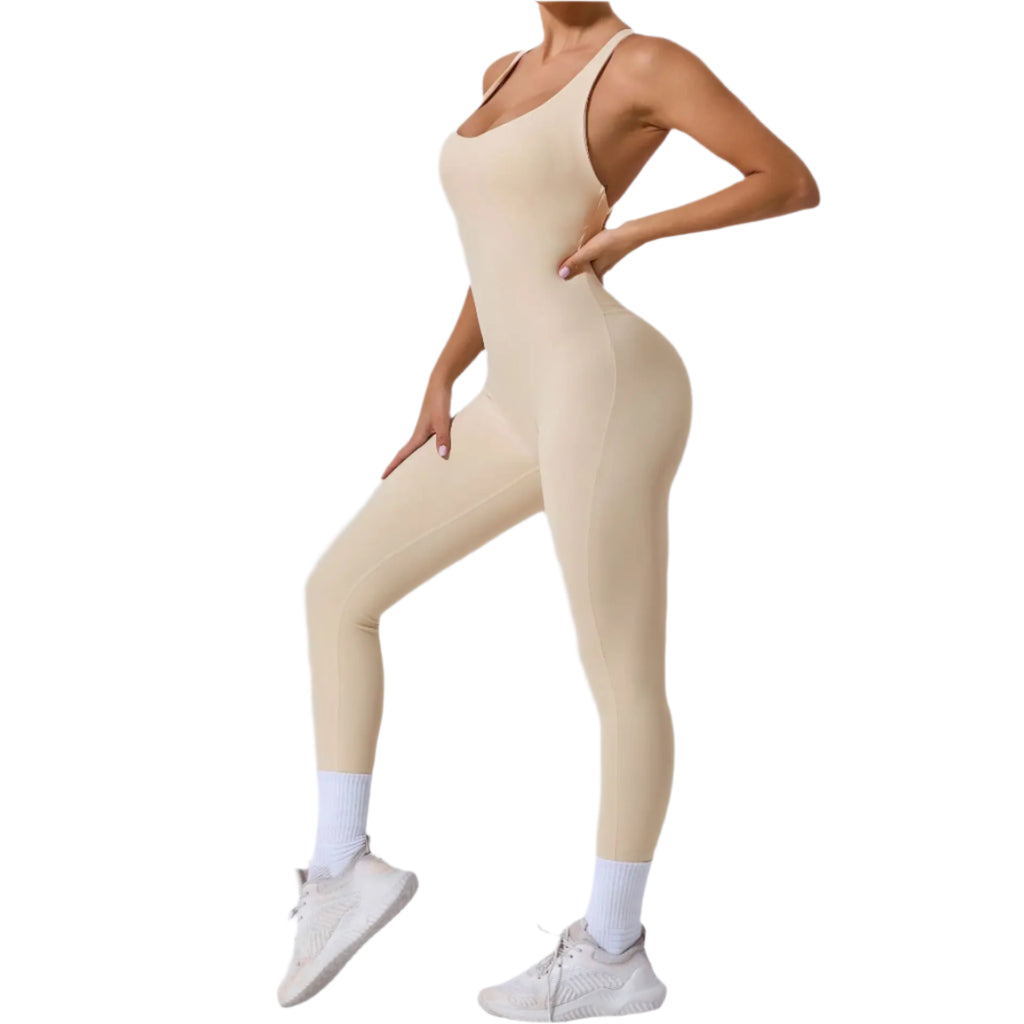 Beige yoga jumpsuit with back straps designed for comfort and flexibility during workouts