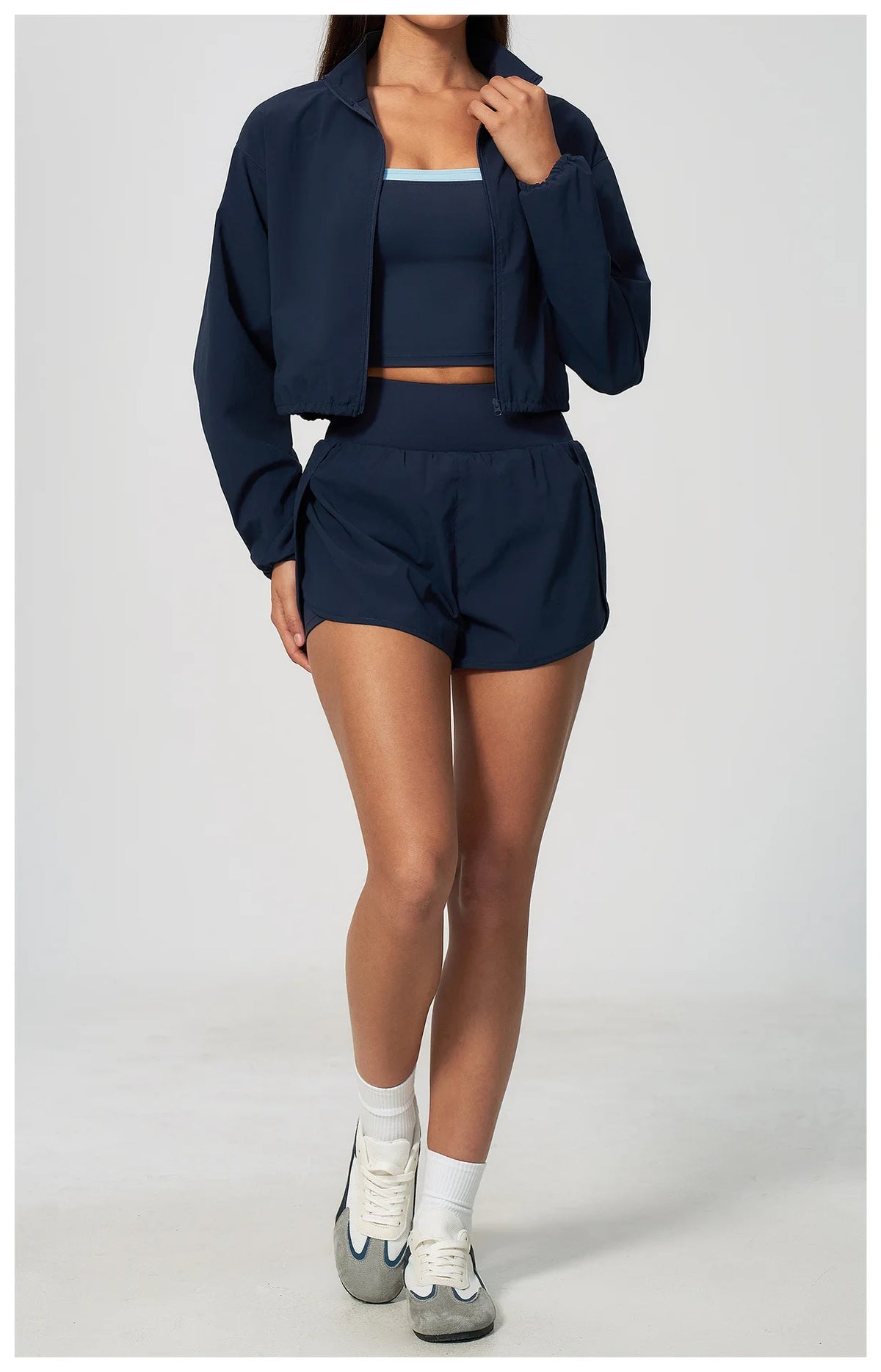 Navy athletic jacket and shorts set with zip front, collared neck, long sleeves