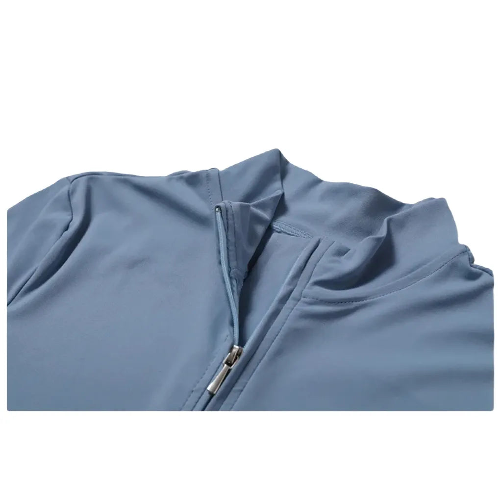 Xooie Fit zipper workout jumpsuit in light blue with a stylish half-zip design for comfort and performance